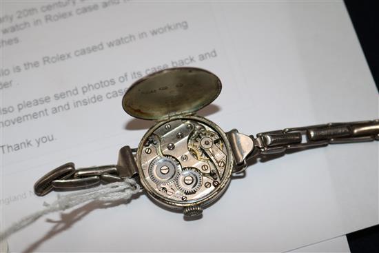 An early 20th century silver manual wind wrist watch in Rolex case and two wrist watches.